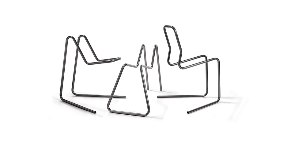Seating made with a tube bending machine with right-hand and left-hand in-process bending capabilities 