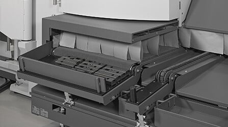 Collection benches are equipped with motorized belts to unload finished parts