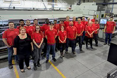 Tuba Inc. team in front of the LT7 machine